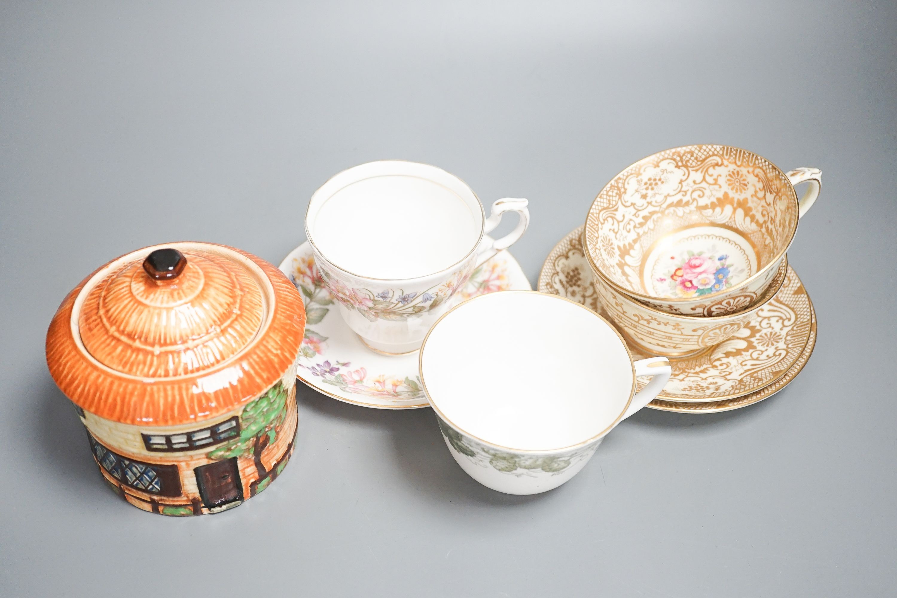 A Crown Staffordshire fifty nine piece part tea set and dessert service, central flowers and gilt borders